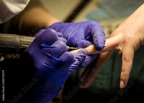 Women do manicures at home. Self-isolation manicure. Nail salon © HENADZI BUKA