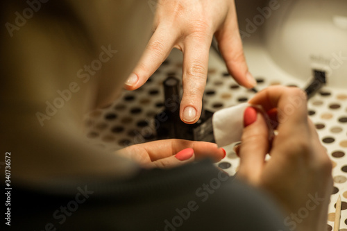 Women do manicures at home. Self-isolation manicure. Nail salon