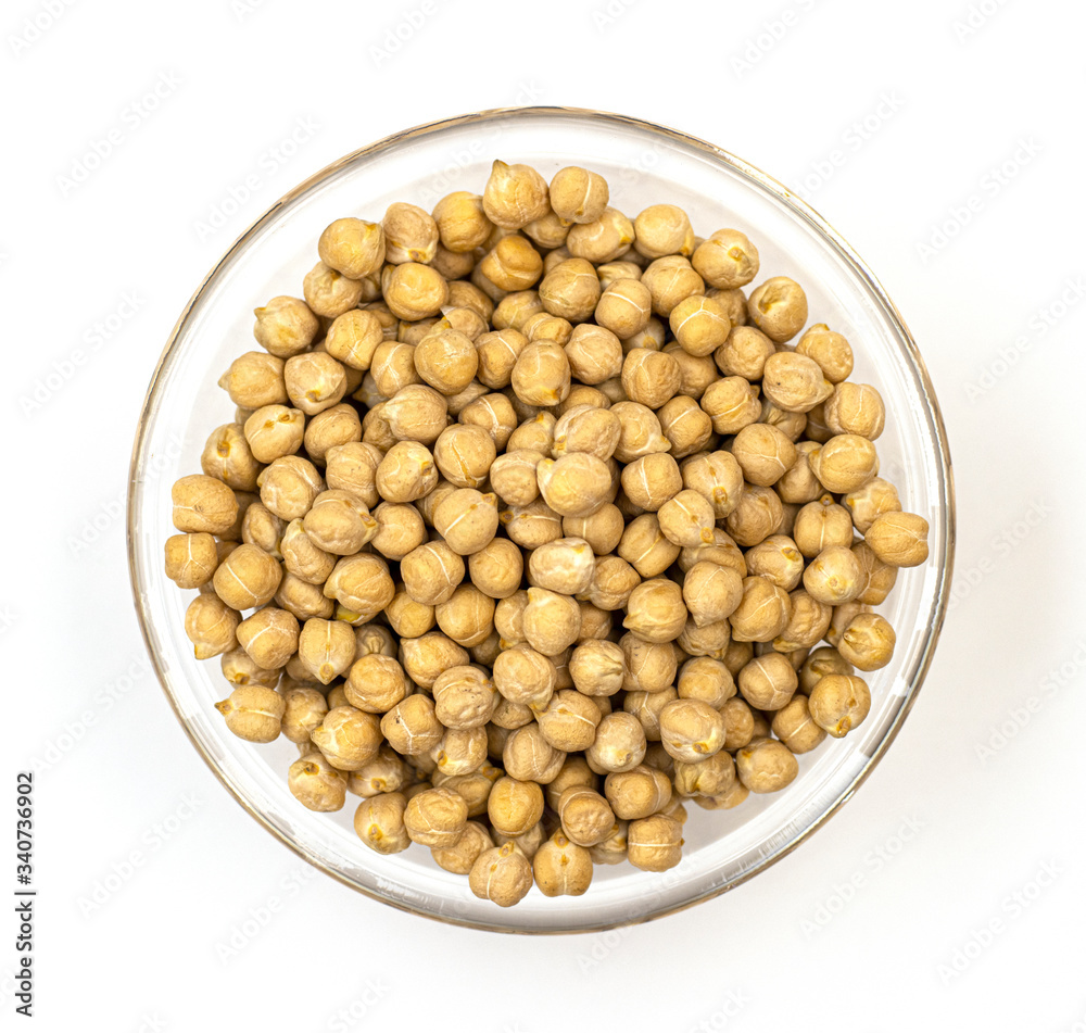 raw chickpeas Turkish lamb peas in a white bowl on a white background. dietary culinary product for women's health. proper nutrition for children raw chickpeas Turkish lamb peas in a white bowl on a white background. dietary culinary product for women's health. proper nutrition for children
