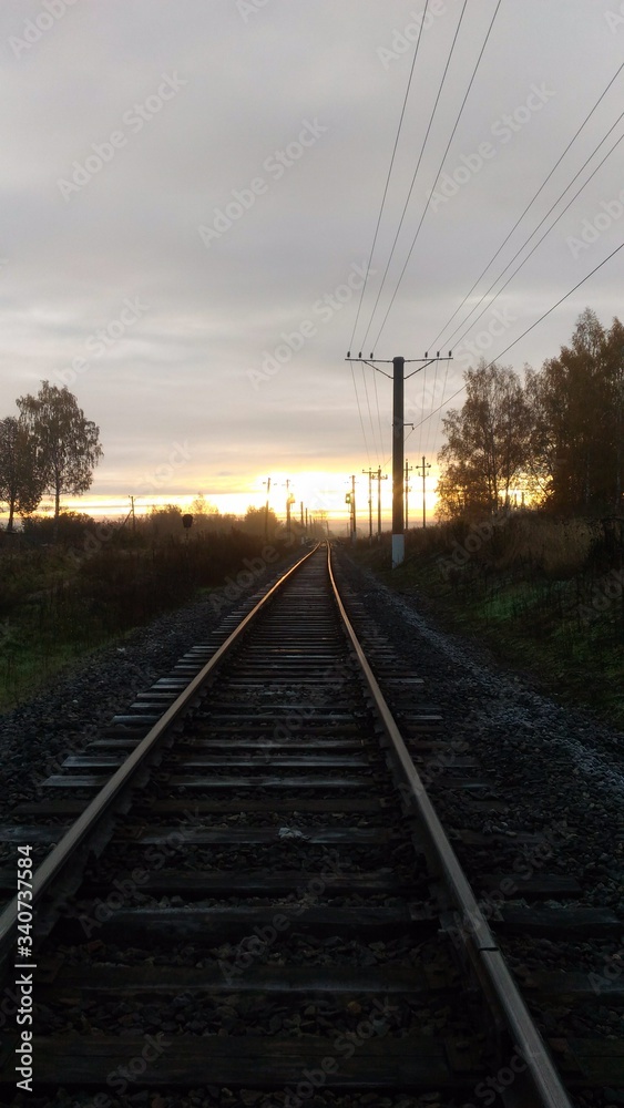 Railroad on sunset background