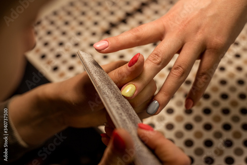 Women do manicures at home. Self-isolation manicure. Nail salon