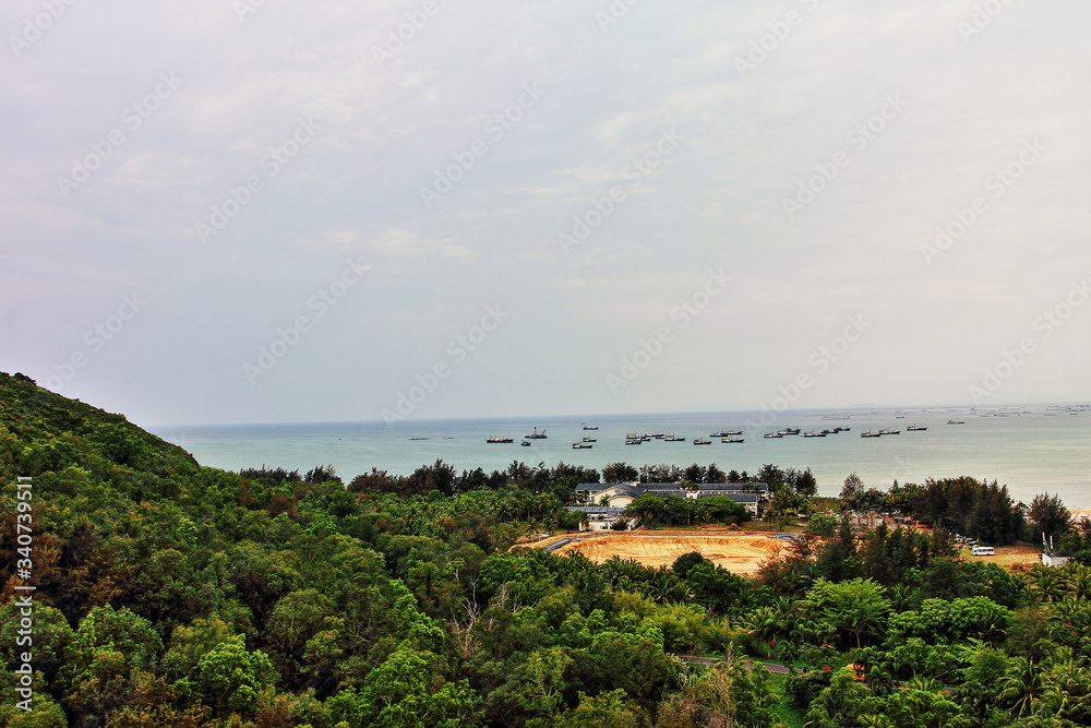 Seascape with ships on Sanya Island in China.