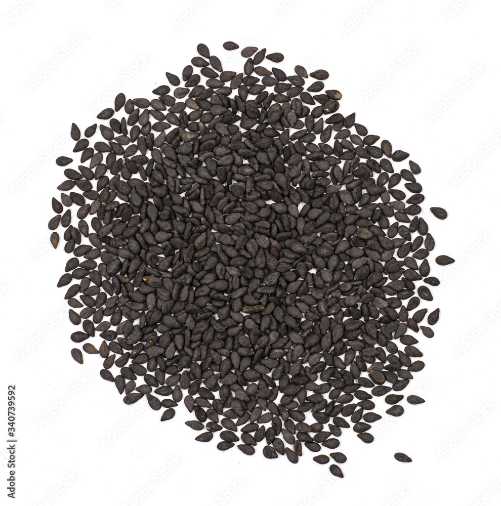 scattered black sesame isolated on a white background. tiny oval, unpeeled seeds of the sesame plant are good for health. seasoning for bakery products scattered black sesame isolated on a white background. tiny oval, unpeeled seeds of the sesame plant are good for health. seasoning for bakery products