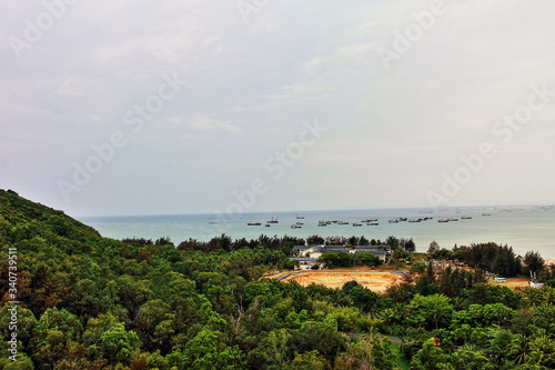 Seascape with ships on Sanya Island in China.