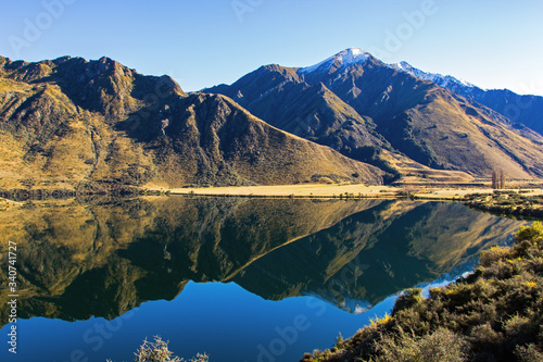 Moke Lake on the South Island of New Zealand. Photograph taken in autumn. Beautiful mountains and lake with reflections near Queenstown. Soft focus.