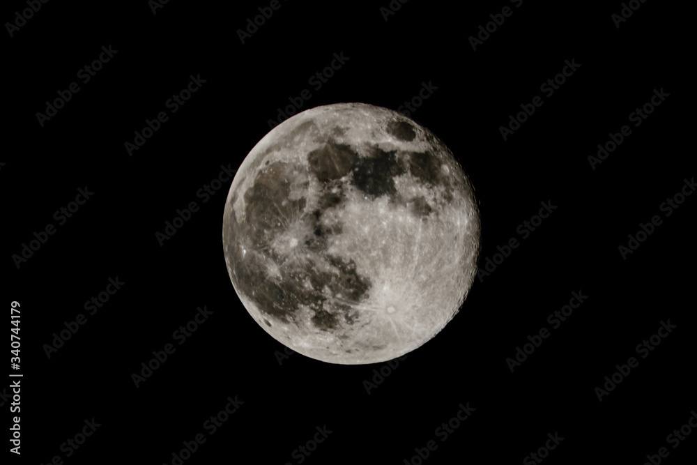 Full moon in a black sky. Astronomy concept Full moon in a black sky. Astronomy concept