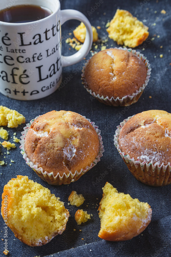 Muffins with coffee on dark background Muffins with coffee on dark background