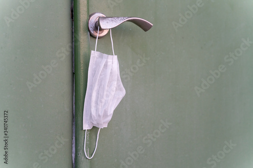 disposable white surgical mask to protect against infection photo