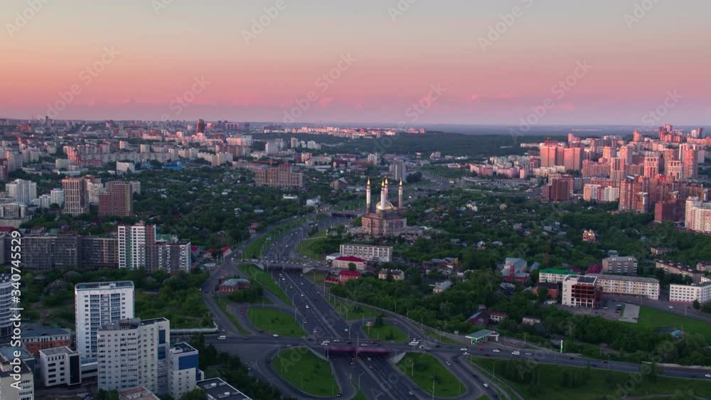 Entrance to the central road artery of the city of Ufa in summer during sunset. View to Ar-Raheem under construction mosque Entrance to the central road artery of the city of Ufa in summer during sunset. View to Ar-Raheem under construction mosque