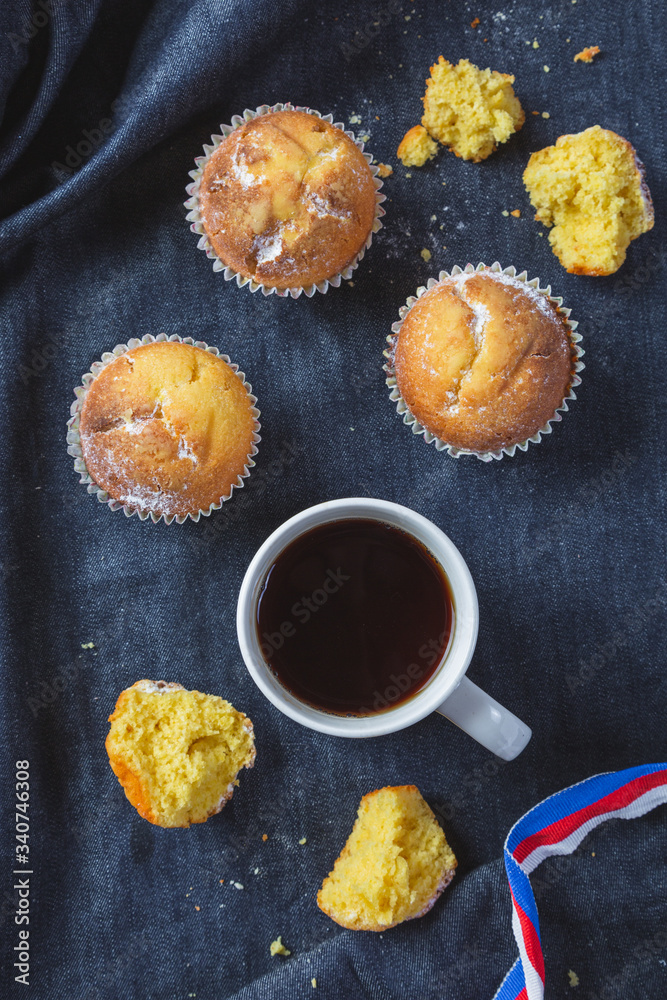 Muffins with coffee on dark background Muffins with coffee on dark background