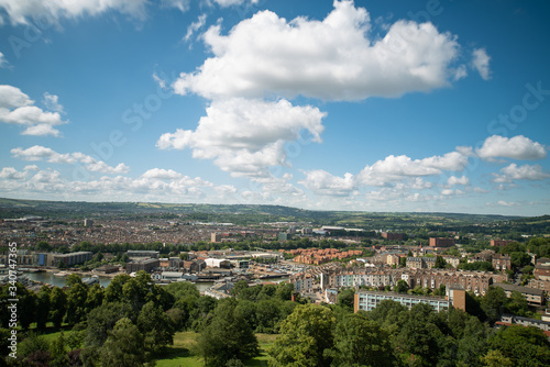 Aerial view of Bristol skyline, a green city in UK with a blue summer sky © Arthur Cauty