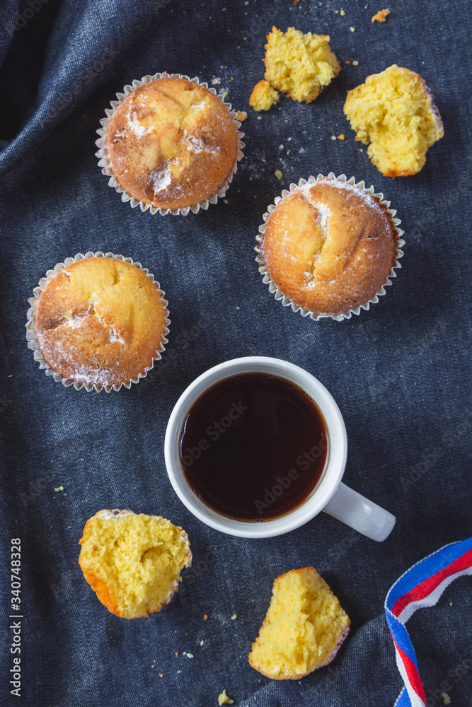 Muffins with coffee on dark background Muffins with coffee on dark background
