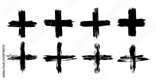 Set of plus signs in grunge style. 8 highly detailed and different crosses. Plus black isolated on white background, vector illustration.
