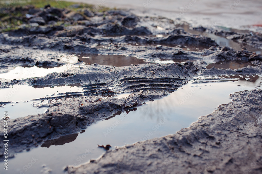 tire protector trace in the puddle of mud tire protector trace in the puddle of mud