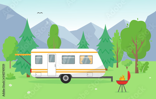 Camping trailer and barbecue near mountains