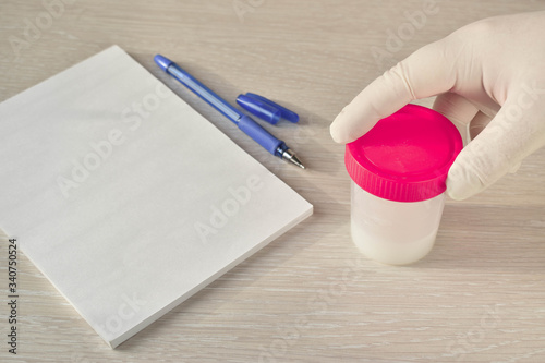 Sperm donation. A jar of tests. The doctor's desk.
