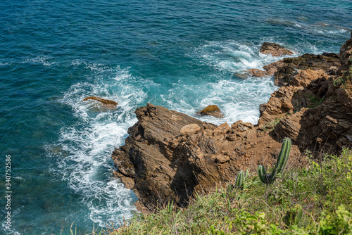 Beautiful view of the Pacific Ocean waves and beach in Punta cometa, Mazunte, Mexico.