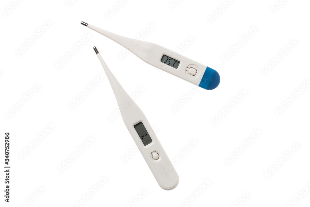 Couple of white thermometer showing the measured temperature, isolated on white background Couple of white thermometer showing the measured temperature, isolated on white background