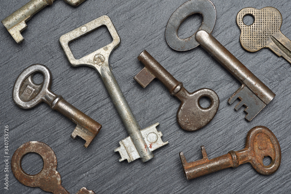 Old rusty lever tumbler keys on black background Old rusty lever tumbler keys on black background