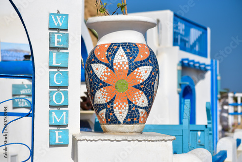 The inscription welcome to the sign of a Greek cafe