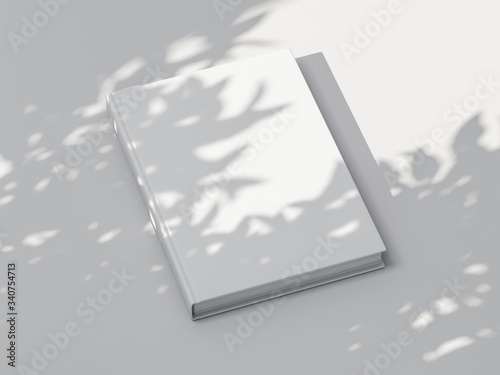 White Book Mockup with textured hardcover on white table outdoors