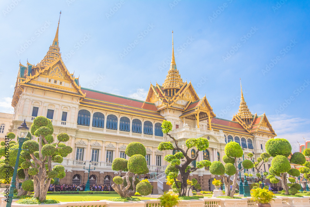 buddhist temple in bangkok with monks and colorful details in southeast asia thailand