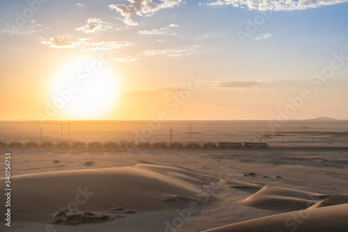 Train at sunrise in namibia desert