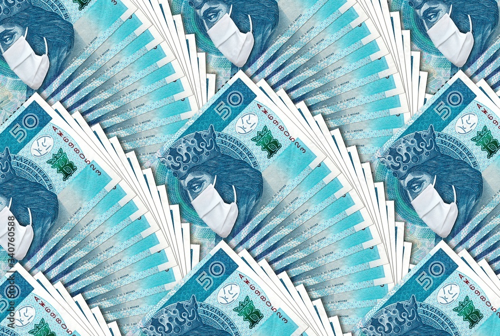 Obraz premium Polish banknote 50 zloty with face mask against Coronavirus pandemic. National Bank of Poland prints bilions zlotych to save Polish economy and prevent country from recession.