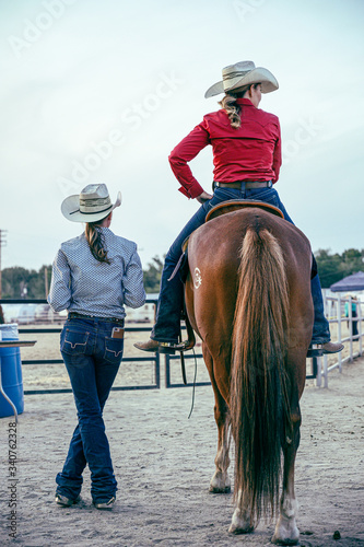 young woman riding a horse
