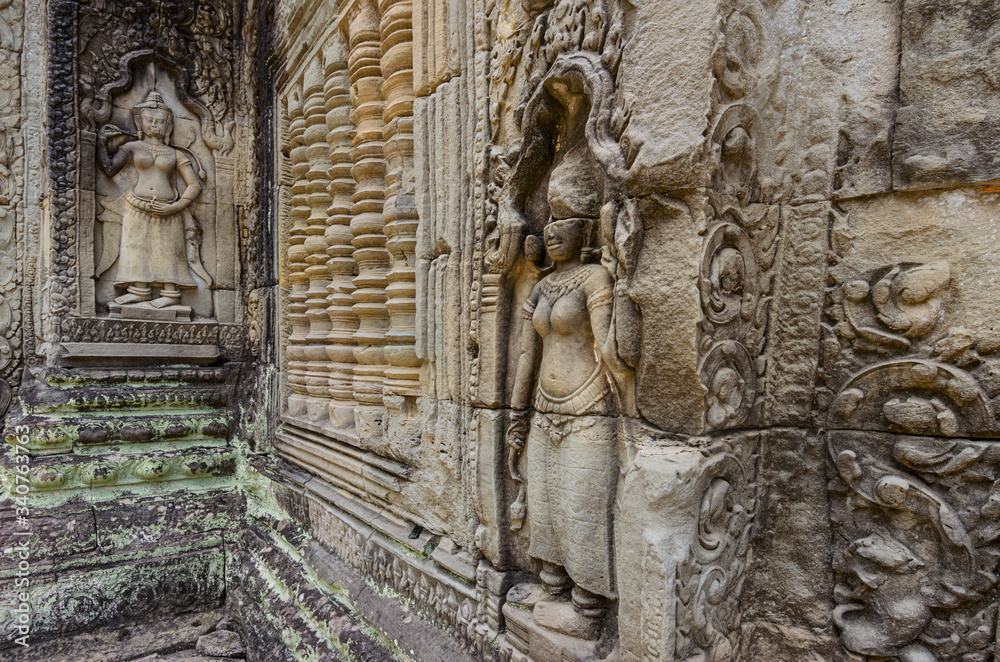 Apsara dancer stone sculpture from Hindu mythology, carved on Preah Khan 