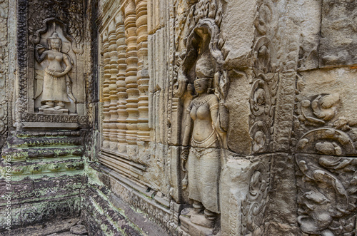 Apsara dancer stone sculpture from Hindu mythology, carved on Preah Khan "Tomb Raider" temple in Angkor Wat Unesco park, Siem Reap, Cambodia