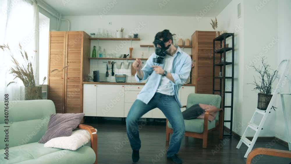 Furnished apartment with a dancing man in a hazmat mask