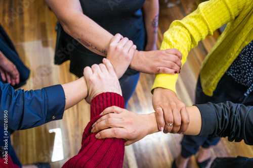 group of business people holding hands