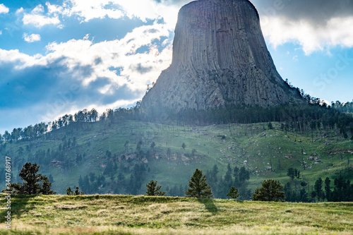 Devils Tower in natural landscape at sunset, Wyoming, United States