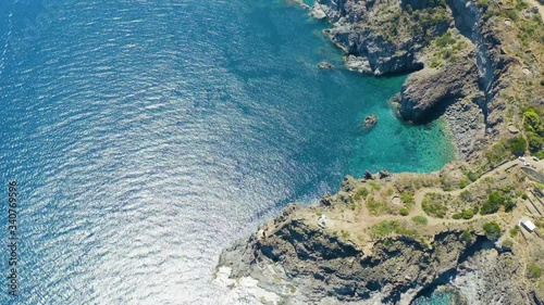 Wallpaper Mural The sea of ​​Pantelleria with its jagged and volcanic coast. Turquoise colored sea. Dammusi, typical houses of Pantelleria. Torontodigital.ca
