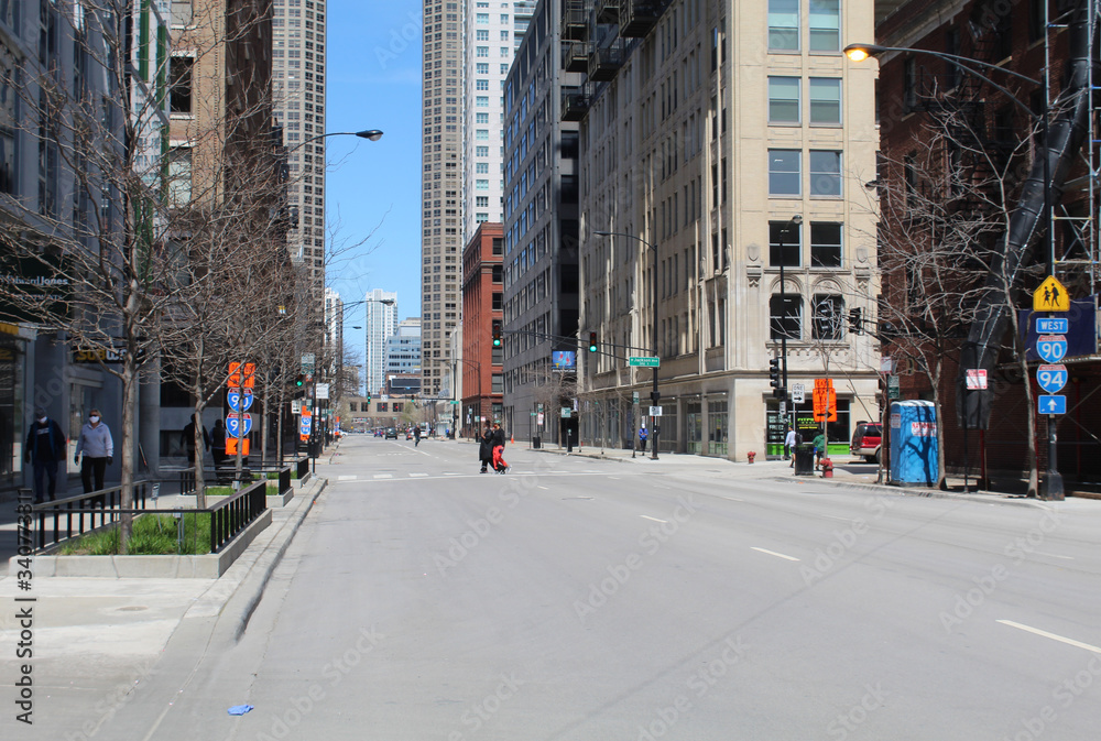 People with PPE masks in the distance on Jefferson Street in downtown Chicago during the COVID-19 shelter in place order