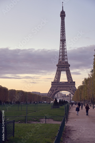 Fototapeta Naklejka Na Ścianę i Meble -  View of Champ de Mars and the Eiffel Tower on a sunset. Paris, France. Copy space.