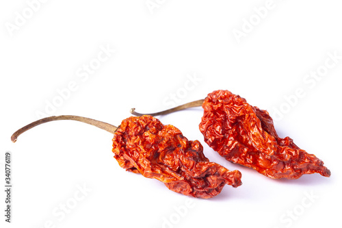 Naga bhut jolokia Chilli dry Indian superhot pepper pod in white photo