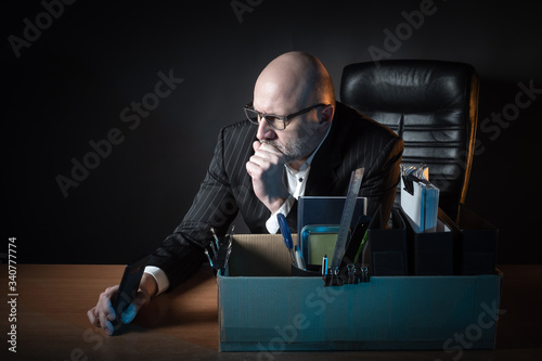 A businessman is sitting at...