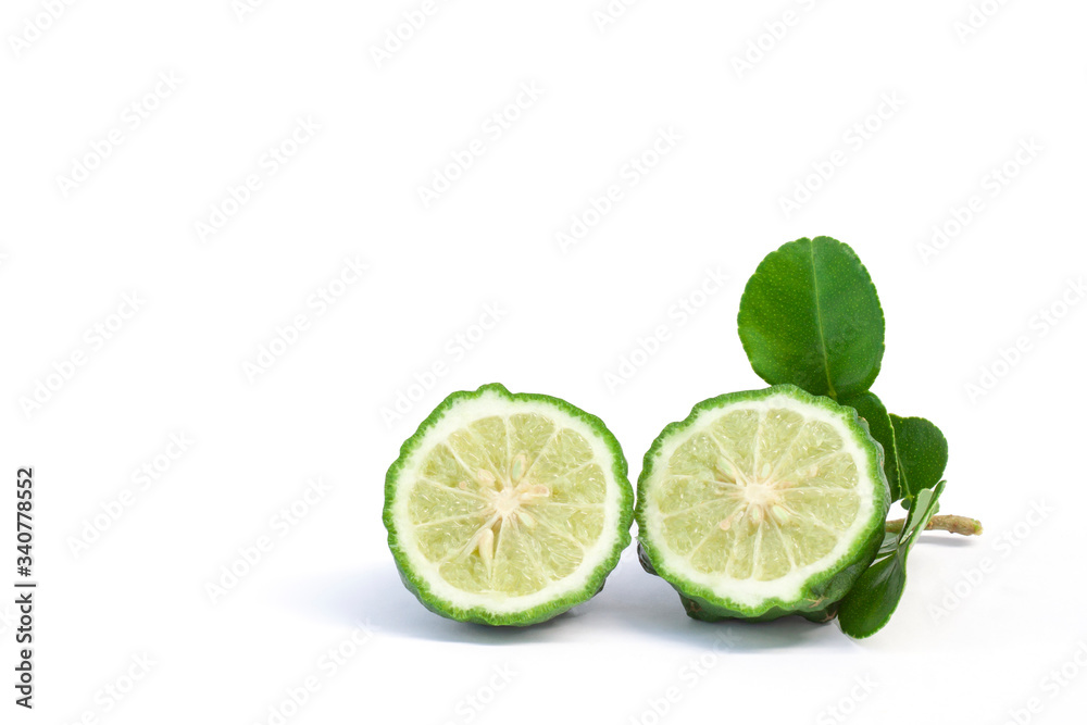 Cut half bergamot, Kaffir lime, Leech lime or Mauritius papeda with leaf is a vegetable and herb of Thailand used as an ingredient in cooking and herbal medicine isolated on white background. Cut half bergamot, Kaffir lime, Leech lime or Mauritius papeda with leaf is a vegetable and herb of Thailand used as an ingredient in cooking and herbal medicine isolated on white background.