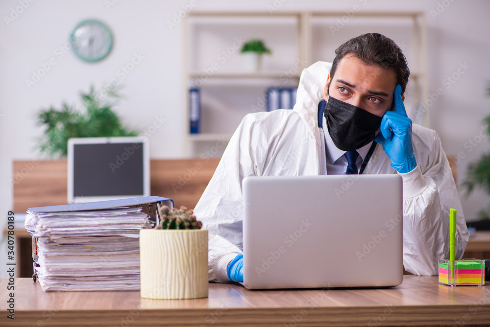 Young male employee in self-isolation concept Young male employee in self-isolation concept