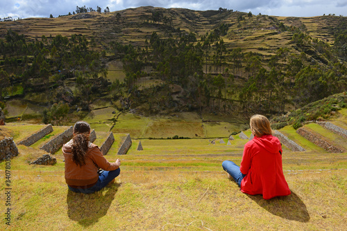 Contemplating the ruins of Chincheros with its terraced agriculture fields in the region of Cusco, Peru.