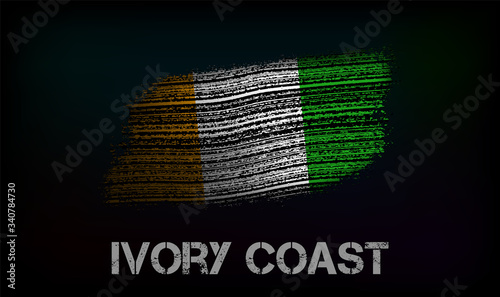 Flag of the Ivory Coast. Vector illustration in grunge style with cracks and abrasions. Good image for print photo