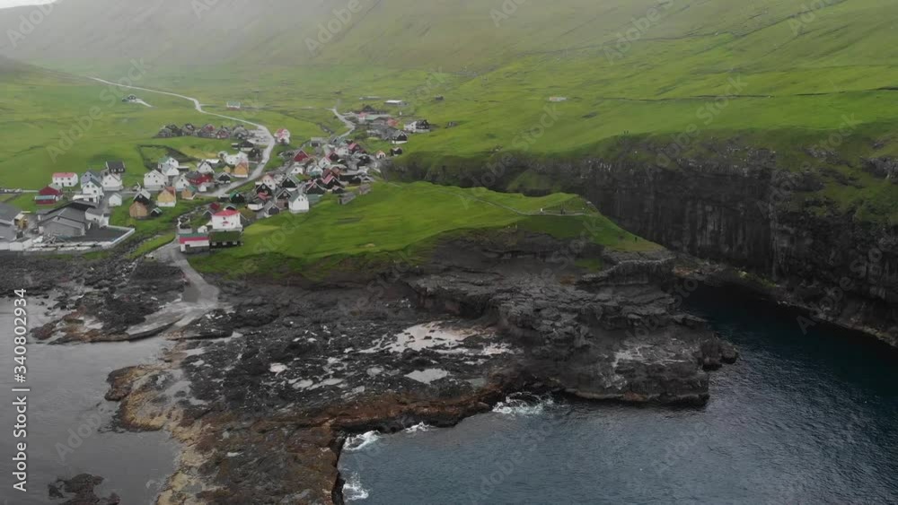 Aerial of small village Gjogv at the Faroe Islands while raining Aerial of small village Gjogv at the Faroe Islands while raining
