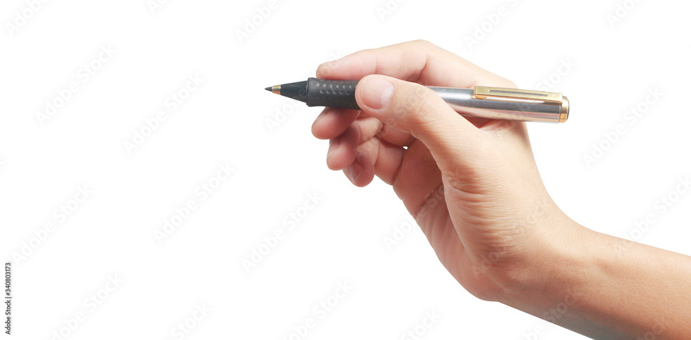 Hand holding pen writing something text isolated Hand holding pen writing something text isolated