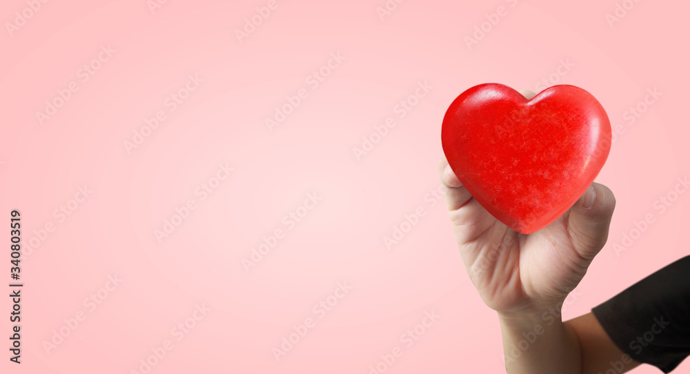 Hands holding red heart. heart health. and donation concepts Hands holding red heart. heart health. and donation concepts
