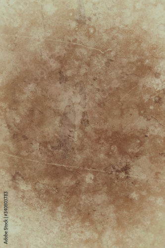Old brown paper background design with distressed vintage stains and paint spatter and grungy faded shabby center, elegant antique beige color borders