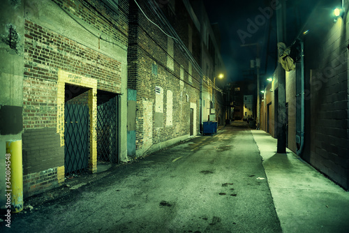 Dark and eerie urban city alley at night  