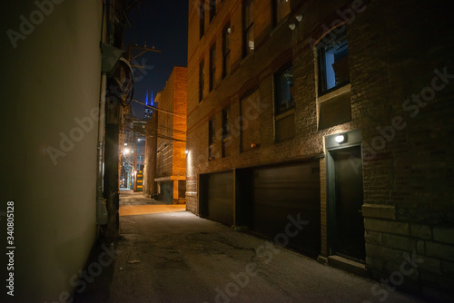 Dark and eerie urban city alley at night  