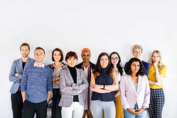 Team standing by a wall